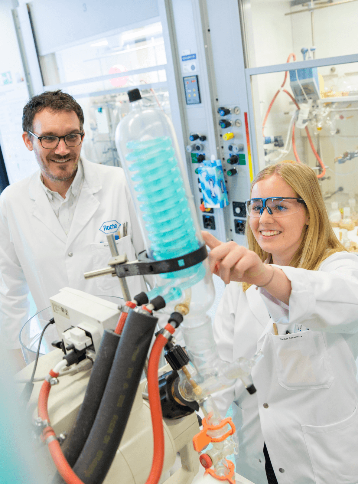 Iamge of two people working in a Roche facility.