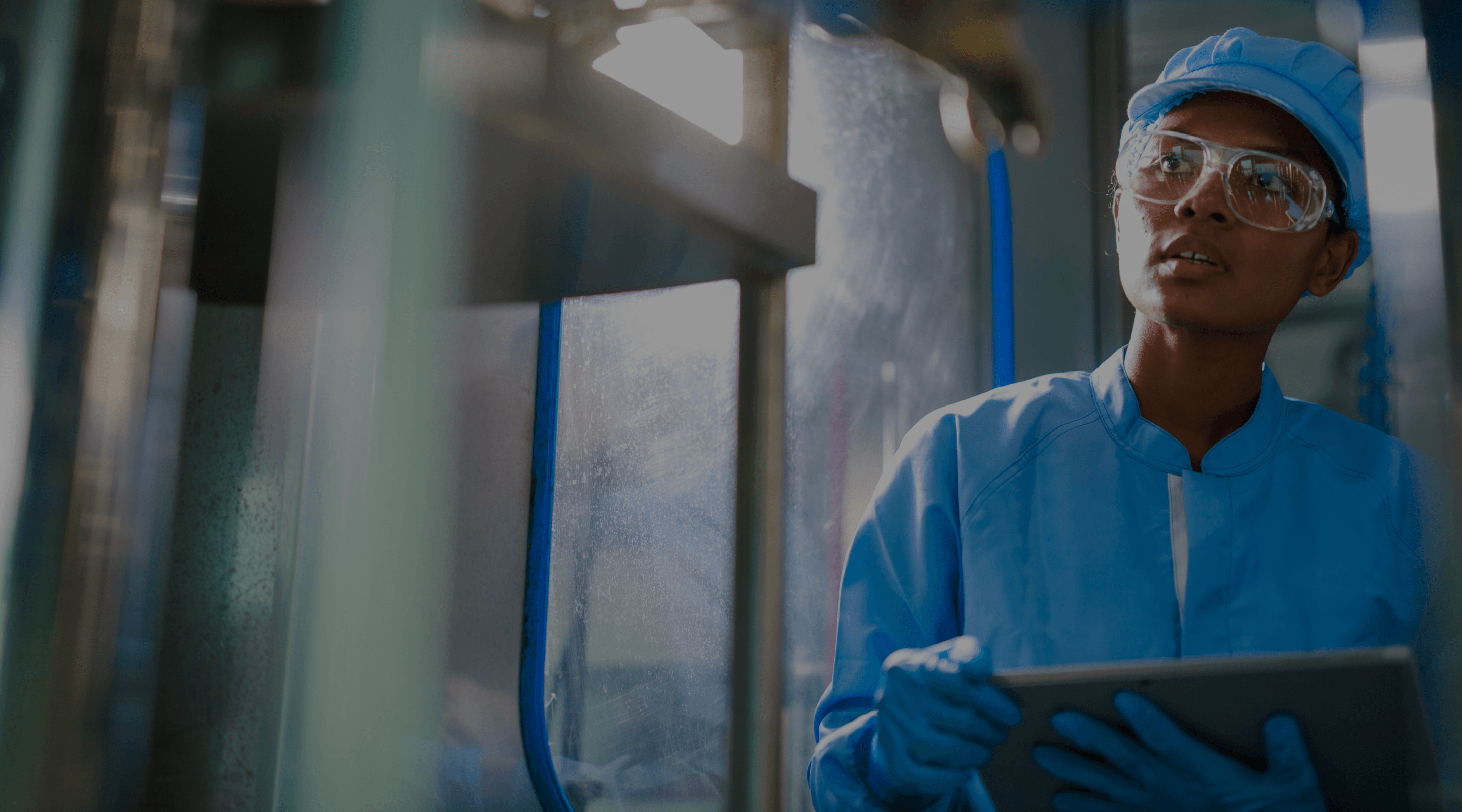Doctor in scrubs looking at monitor.