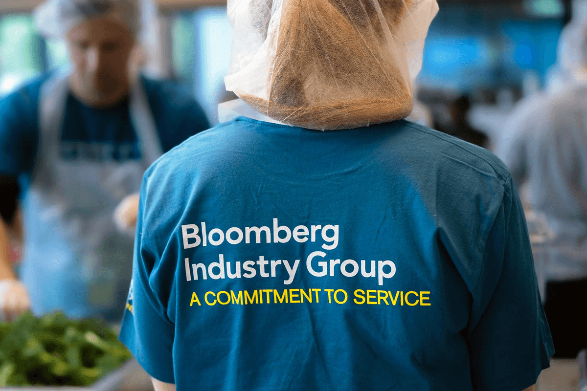 a person wearing a blue bloomberg industry group shirt