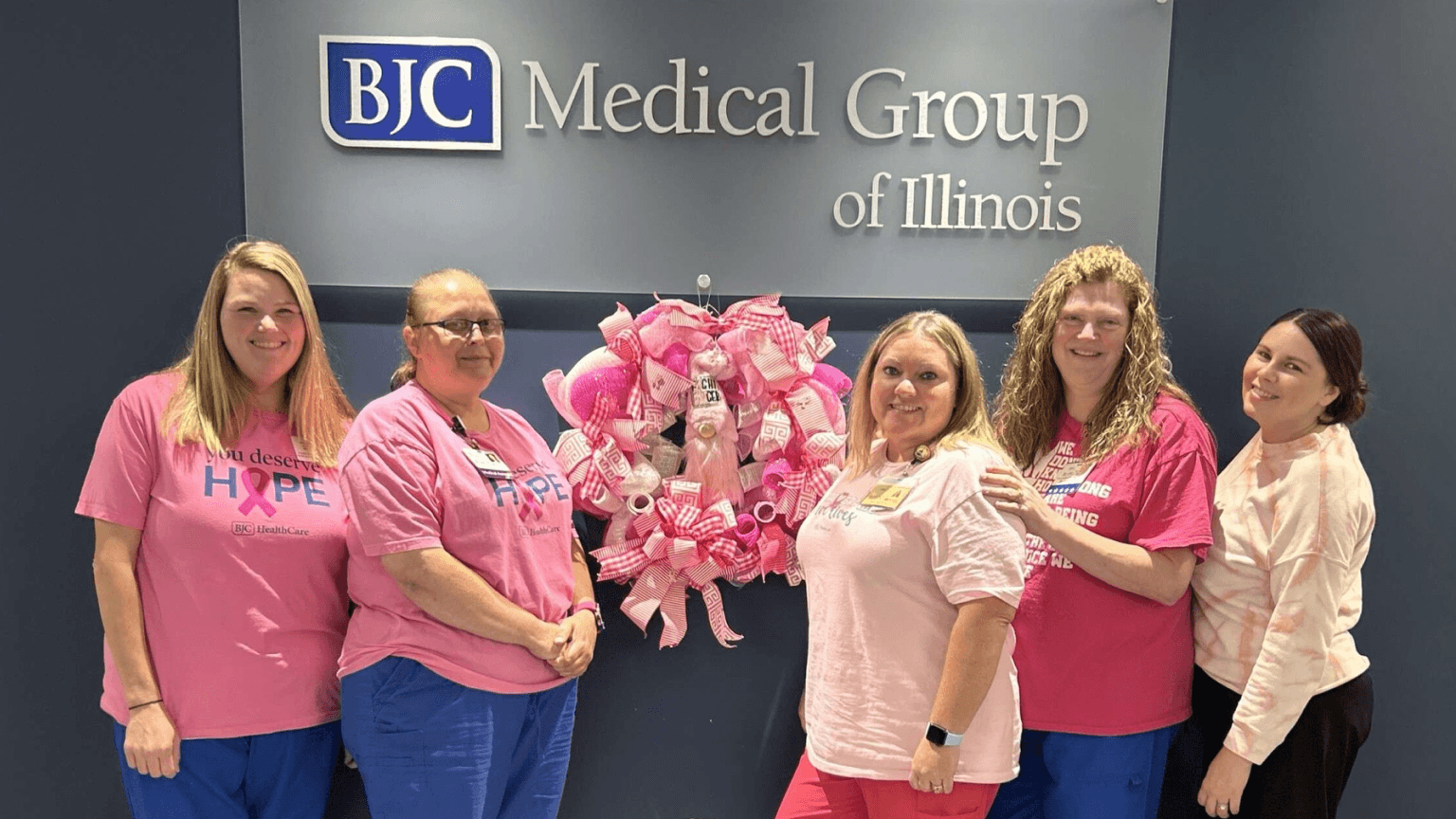 Image of healthcare workers in front a hope display.